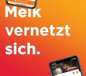 Text: Melk vernetzt sich - der Hintergrund des Bildes verläuft in rot orangen Farben und es ist ein Smartphone zu sehen.